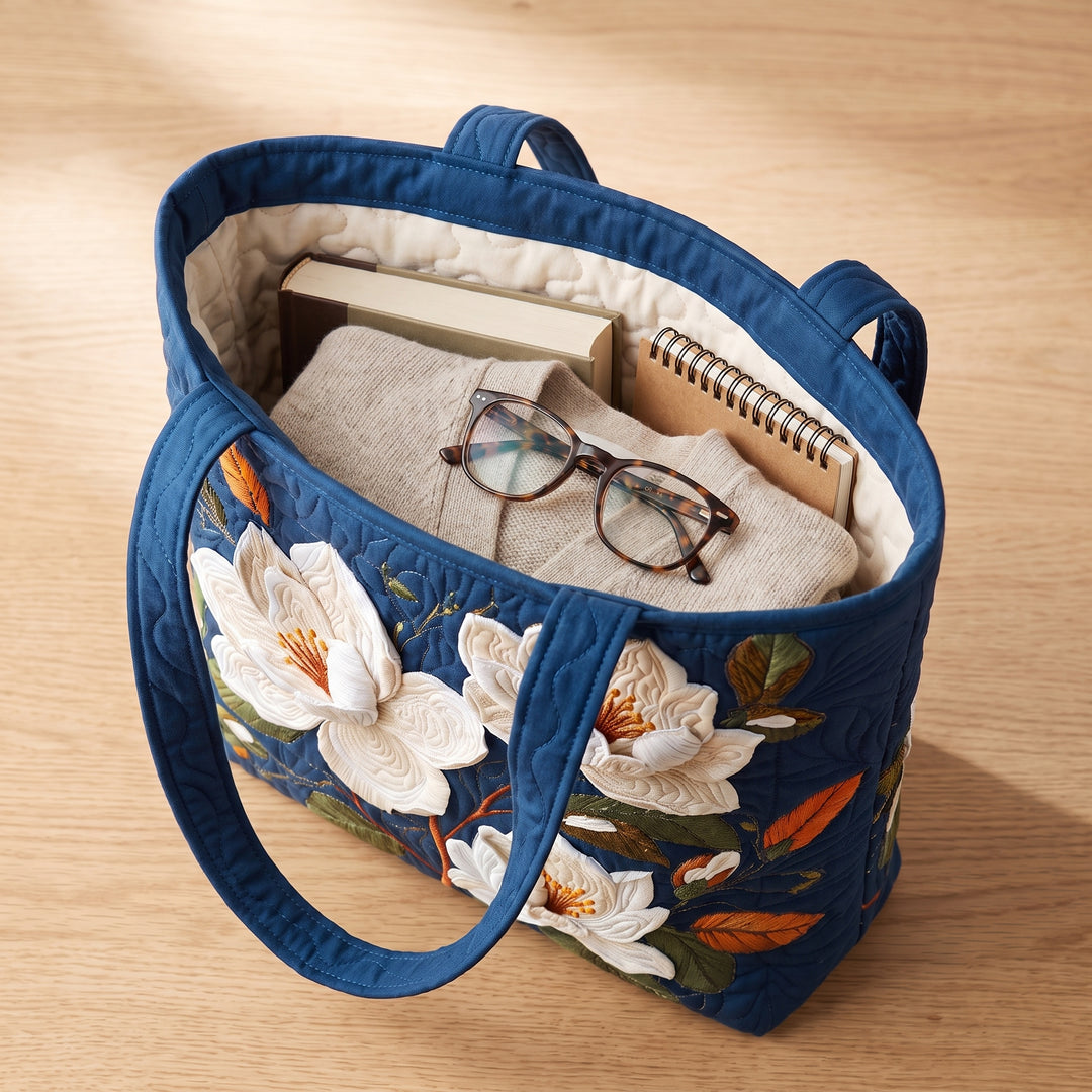 Artisan Quilted Bag - Delicate Magnolia — packed with a hardback book, a folded cardigan and reading glasses